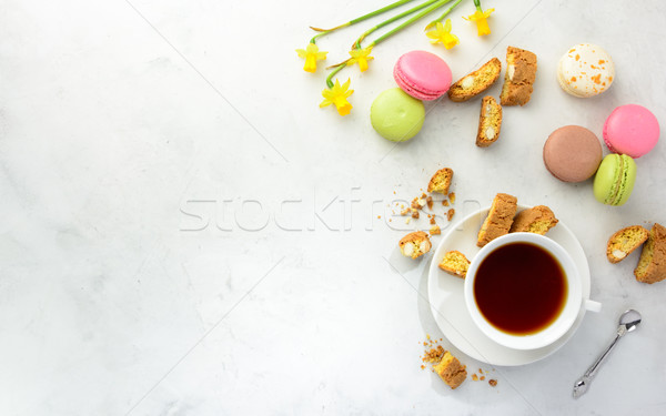 Tea with cookies,  macaroоns and flowers. Flat lay. Stock photo © markova64el