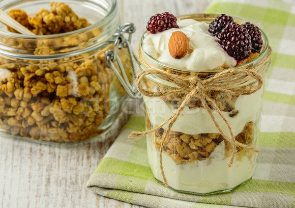 Healthy breakfast ingredients on a white wooden table. Stock photo © markova64el