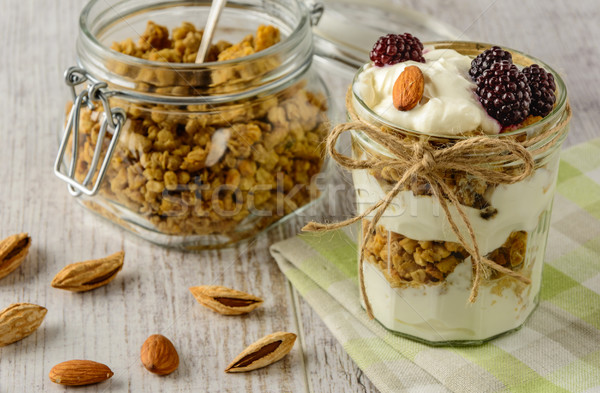 Healthy breakfast ingredients on a white wooden table. Stock photo © markova64el