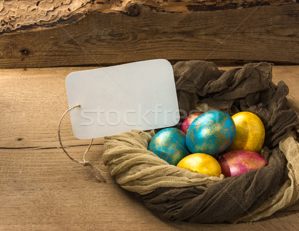  Easter eggs ion a natural wooden background. Copy space. Stock photo © markova64el