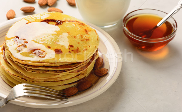 Pancakes with honey and almond  Stock photo © markova64el