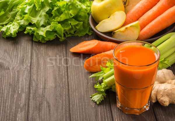 Carrot and apple juice with vegetables on dark wooden background Stock photo © markova64el