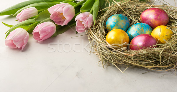 Easter eggs paglia nido coniglio pasquale cookies tulipani Foto d'archivio © markova64el