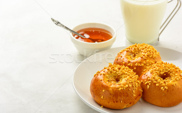 Breakfast of  brioche buns with milk and honey . Stock photo © markova64el