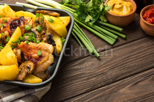 Stock photo: Dinner with baked chicken legs and vegetable. 