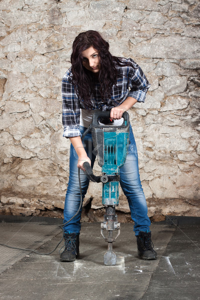 Young long-haired woman with a jackhammer Stock photo © maros_b