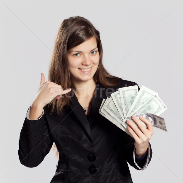 Young long-haired woman holding money Stock photo © maros_b