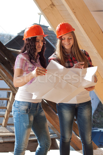Two young women workers on the roof Stock photo © maros_b