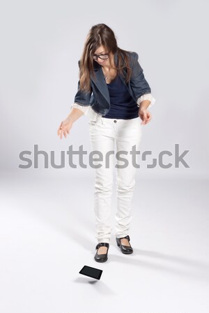 молодые женщину таблетка очки ПК падение Сток-фото © maros_b