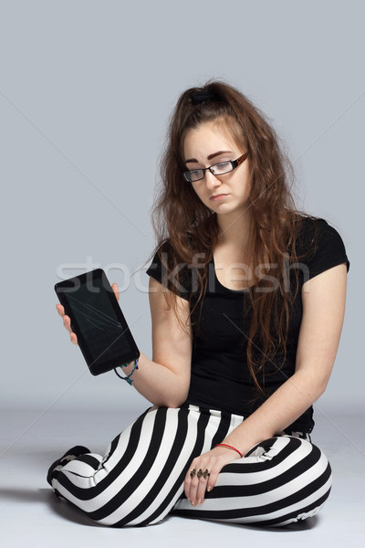 Tablet triste adolescente ragazza strisce Foto d'archivio © maros_b
