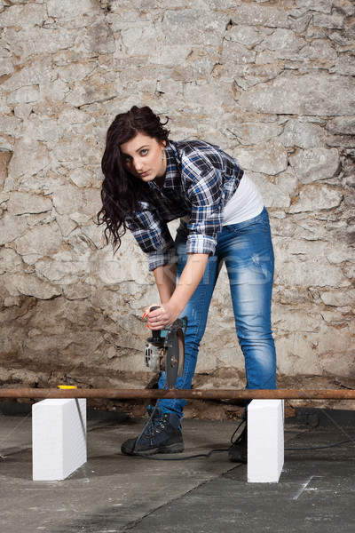 Young long-haired woman with an angle grinder Stock photo © maros_b