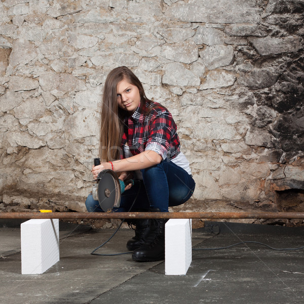 Young long-haired woman with an angle grinder Stock photo © maros_b