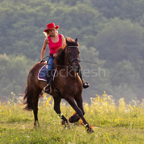 Woman in red hat riding Stock photo © maros_b