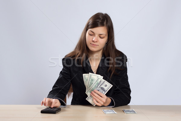 Young woman counts money Stock photo © maros_b