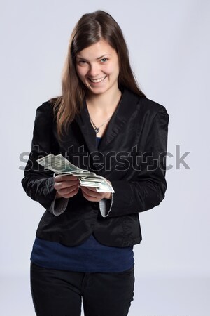 Young long-haired woman holding money Stock photo © maros_b
