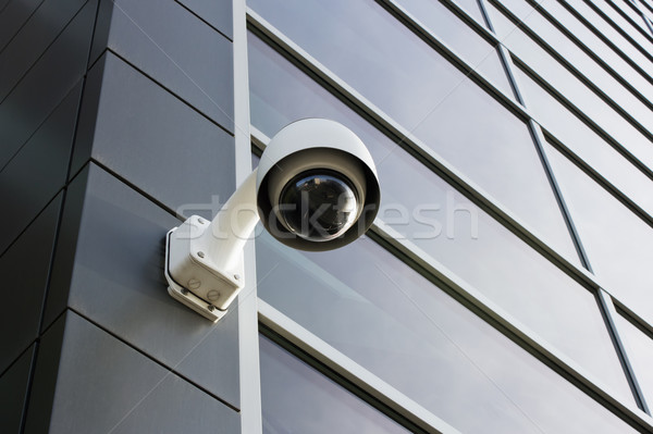 Biztonsági kamera modern épület homlokzat épület fal technológia Stock fotó © martin33