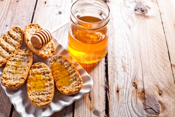 crackers in plate and honey  Stock photo © marylooo