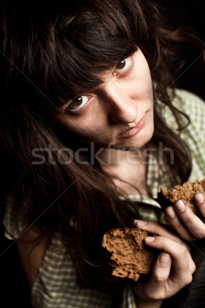  beggar woman with bread  Stock photo © marylooo