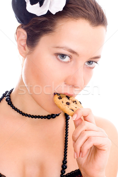 woman in corset and little hat eating cookie Stock photo © marylooo