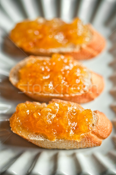 pieces of baguette with orange marmalade Stock photo © marylooo