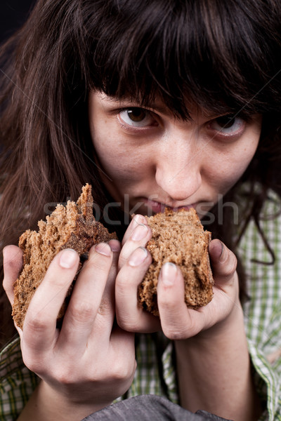 Koldus nő darab kenyér kezek portré Stock fotó © marylooo