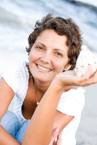 woman on seacoast with a cockleshell  Stock photo © marylooo