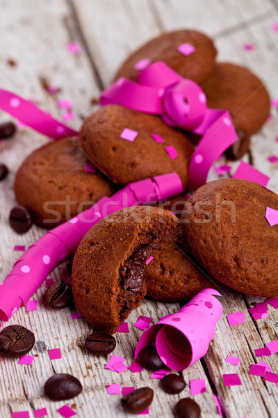 fresh chocolate cookies, coffee beans, pink ribbons and confetti Stock photo © marylooo