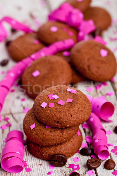 fresh chocolate cookies, coffee beans, pink ribbons and confetti Stock photo © marylooo