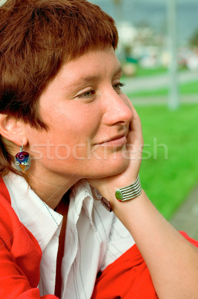 Stock photo:  redhead woman in red