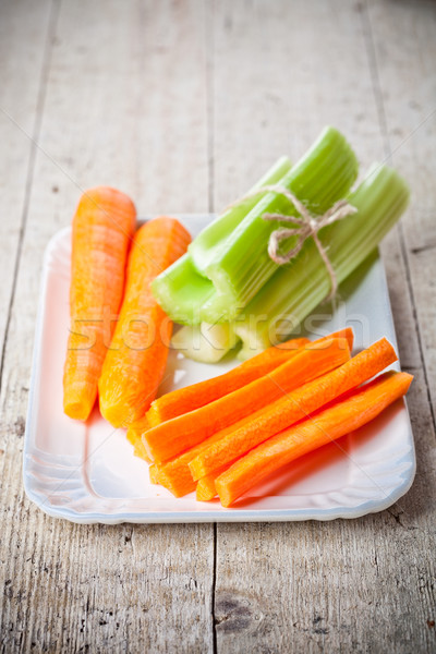 bundle of fresh green celery stems and carrot Stock photo © marylooo