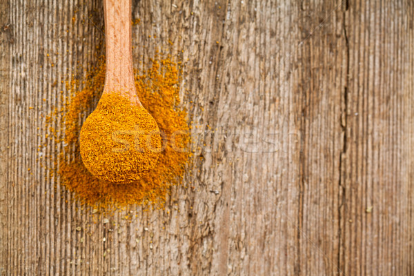 curry powder in wooden spoon  Stock photo © marylooo