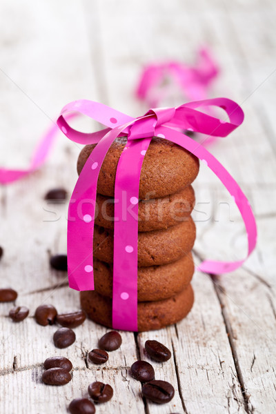 stack of chocolate cookies tied with pink ribbon and coffee bean Stock photo © marylooo