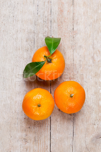 three tangerines with leaves  Stock photo © marylooo