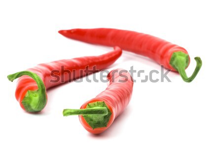 Három piros hűvös paprikák fehér étel Stock fotó © marylooo