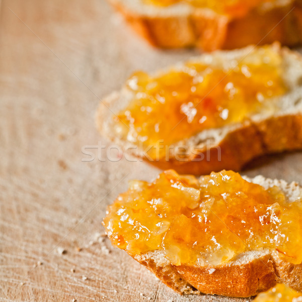 Darabok francia kenyér narancs közelkép fa deszka fa Stock fotó © marylooo