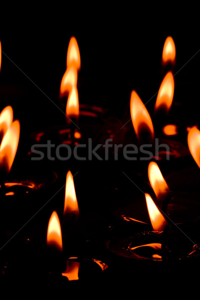 Vlammende kaarsen groep brand achtergronden godsdienst Stockfoto © marylooo
