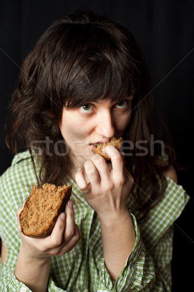 Bettler Frau Essen Brot Porträt armen Stock foto © marylooo