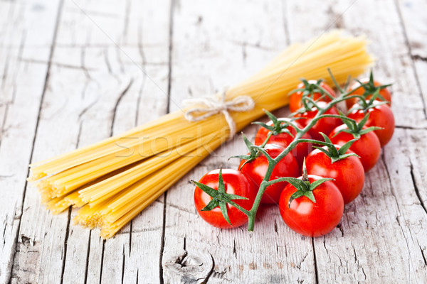 uncooked pasta and fresh tomatoes Stock photo © marylooo