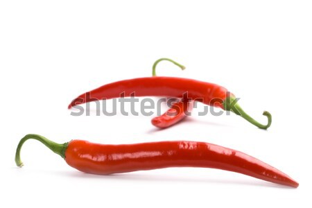 Három piros hűvös paprikák fehér étel Stock fotó © marylooo