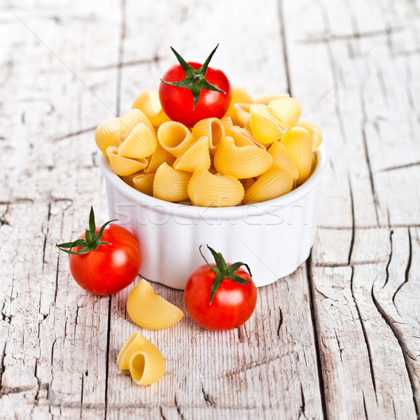uncooked pasta and cherry tomatoes in a bowl Stock photo © marylooo