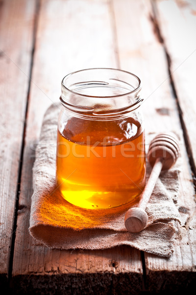 full honey pot and honey stick Stock photo © marylooo