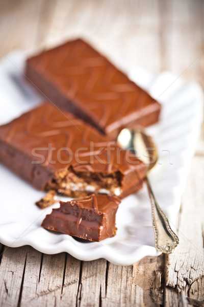 dark chocolate cakes and spoon on a plate  Stock photo © marylooo