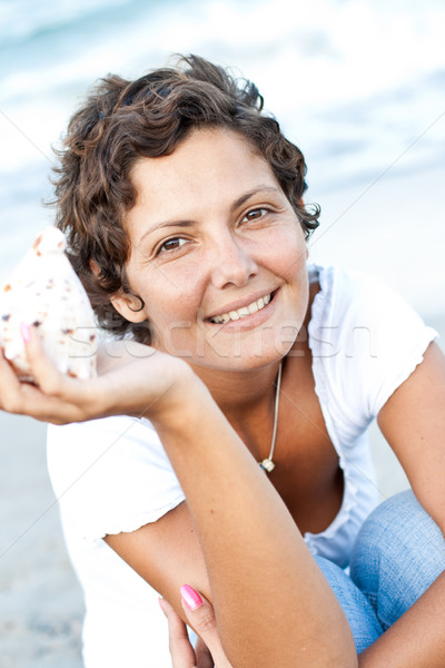 woman on seacoast with a cockleshell Stock photo © marylooo