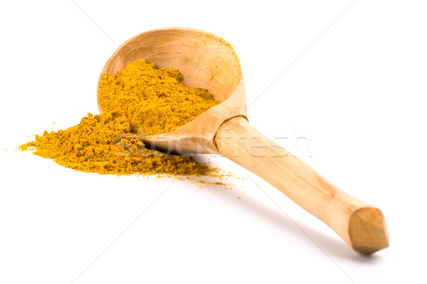 yellow turmeric on wooden spoon Stock photo © marylooo