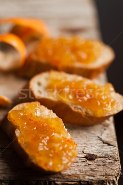 Stücke Baguette orange rustikal Holzbrett Stock foto © marylooo