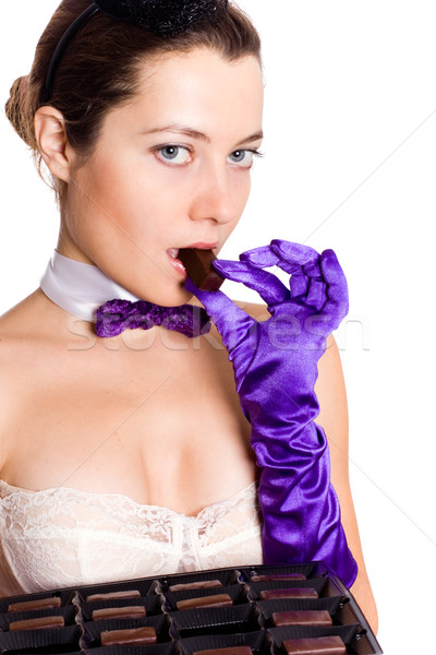 woman in corset and little hat eating sweets Stock photo © marylooo