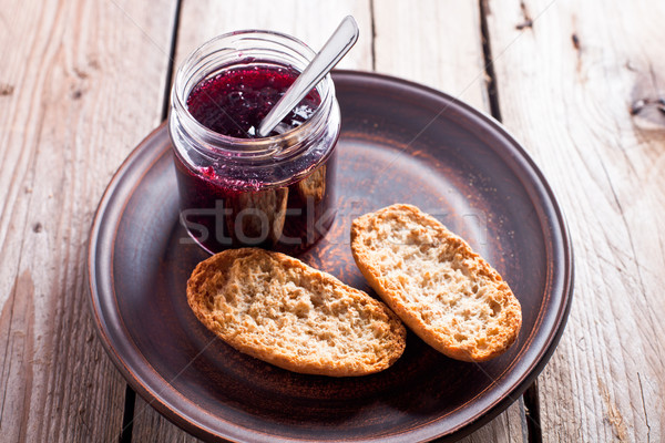 black currant jam in glass jar and crackers Stock photo © marylooo