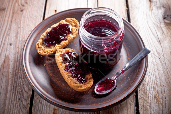 black currant jam in glass jar and crackers Stock photo © marylooo