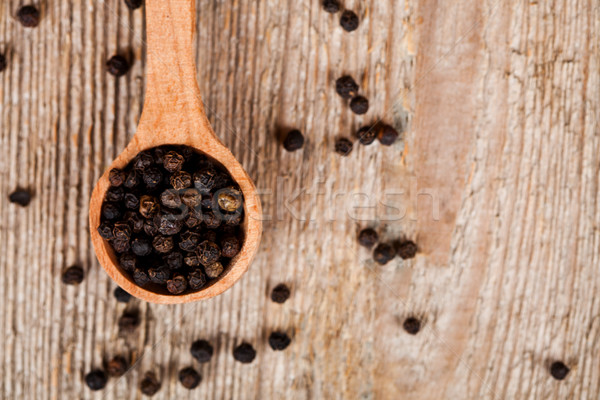 black peper in wooden spoon  Stock photo © marylooo