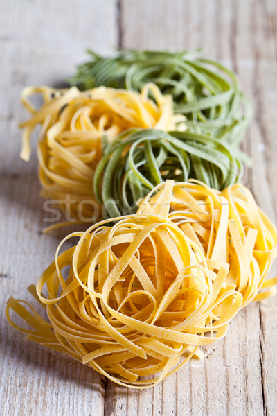 yellow and green uncooked pasta tagliatelle Stock photo © marylooo